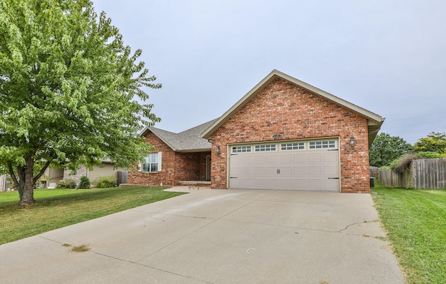 view of front facade with a garage and a front yard