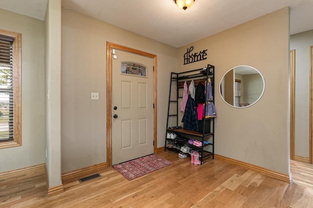 entrance foyer with light hardwood / wood-style flooring