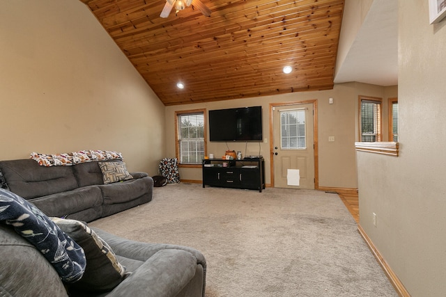 living room featuring lofted ceiling, ceiling fan, carpet floors, and wooden ceiling