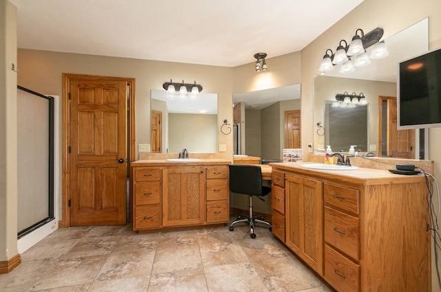 bathroom featuring an enclosed shower and vanity