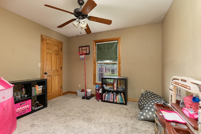 rec room featuring ceiling fan and light colored carpet