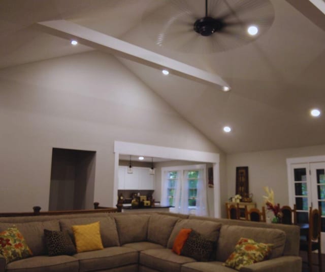 living area featuring high vaulted ceiling, french doors, beamed ceiling, and recessed lighting