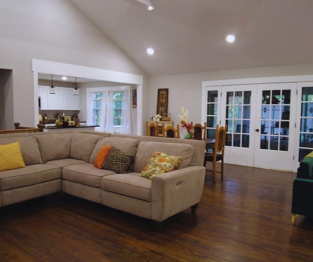 living area featuring recessed lighting, dark wood finished floors, high vaulted ceiling, and french doors