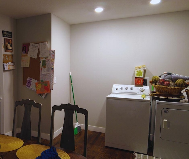 clothes washing area featuring recessed lighting, wood finished floors, washing machine and clothes dryer, and laundry area