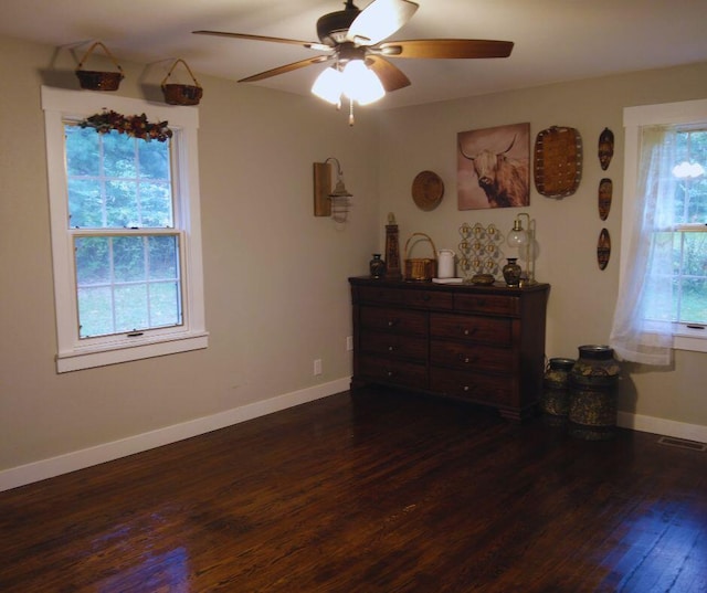 bedroom featuring a ceiling fan, baseboards, dark wood-style flooring, and visible vents