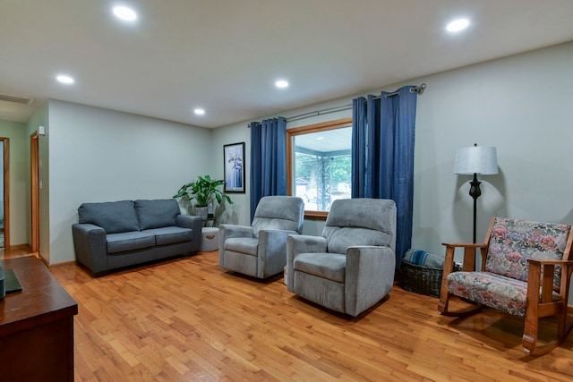 living room with light hardwood / wood-style flooring