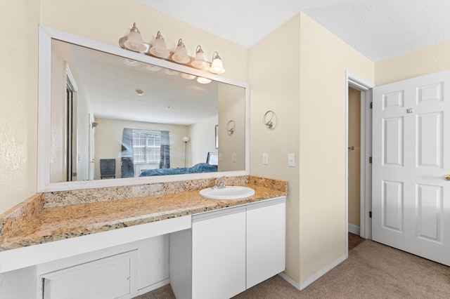 bathroom featuring vanity and a textured ceiling