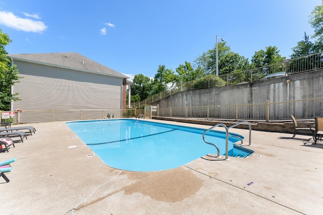 view of pool featuring a patio