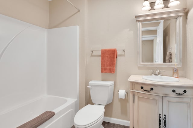 full bathroom featuring vanity, washtub / shower combination, and toilet