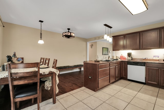 kitchen with sink, light hardwood / wood-style floors, kitchen peninsula, decorative light fixtures, and dishwasher