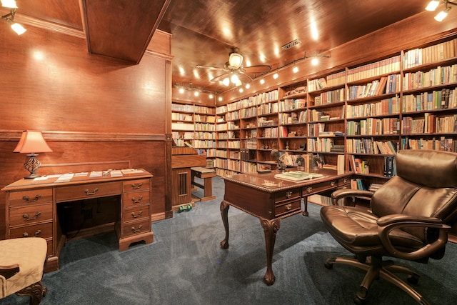 office featuring wooden walls, built in features, wooden ceiling, and carpet flooring