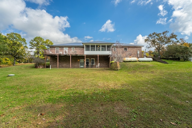 back of property featuring a yard and a sunroom