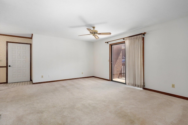 carpeted empty room featuring ceiling fan