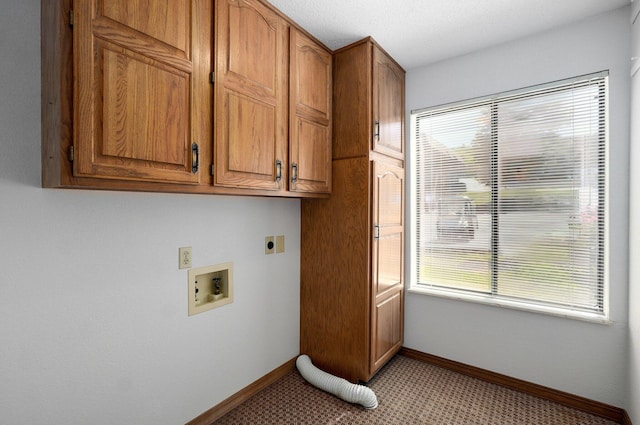 laundry area with washer hookup, hookup for an electric dryer, and cabinets