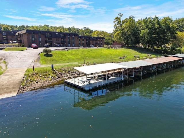 view of dock featuring a yard and a water view