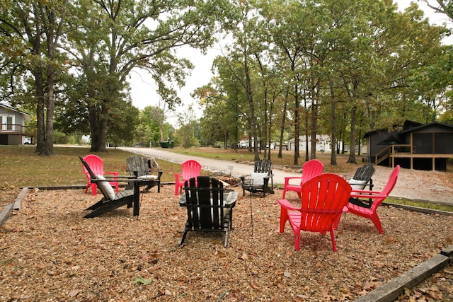 view of community with an outdoor fire pit