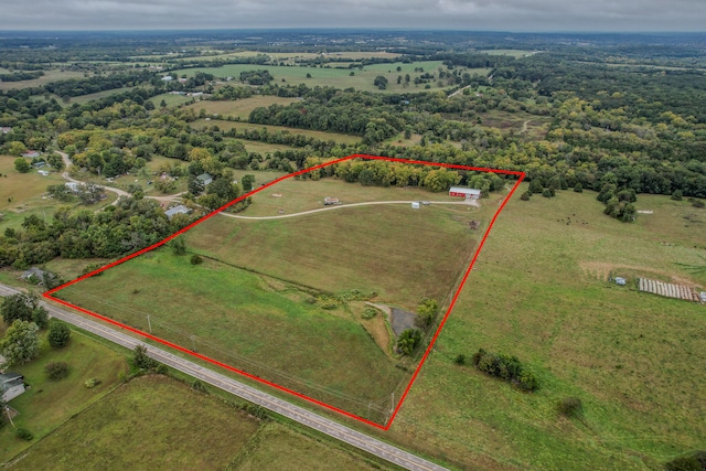 birds eye view of property featuring a rural view