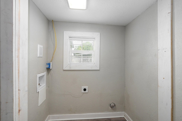 washroom featuring washer hookup, a textured ceiling, and electric dryer hookup