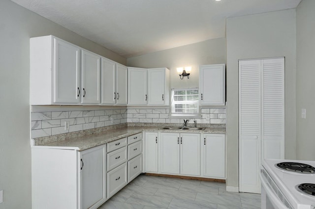 kitchen featuring white electric stove, white cabinetry, sink, and backsplash