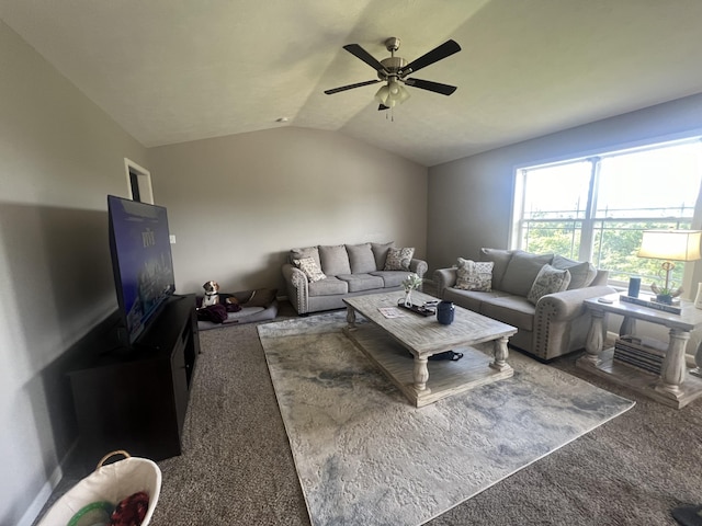 living room featuring ceiling fan, carpet floors, and vaulted ceiling