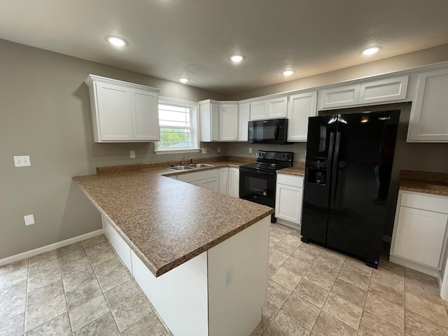 kitchen with white cabinets, sink, kitchen peninsula, and black appliances