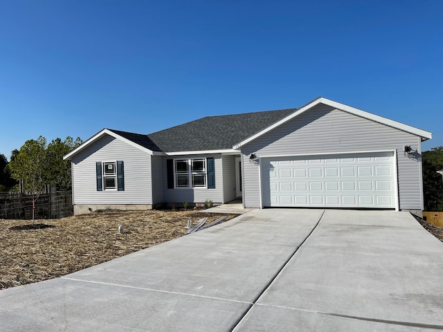 ranch-style home featuring a garage