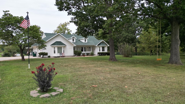 view of front of home with a porch and a front yard