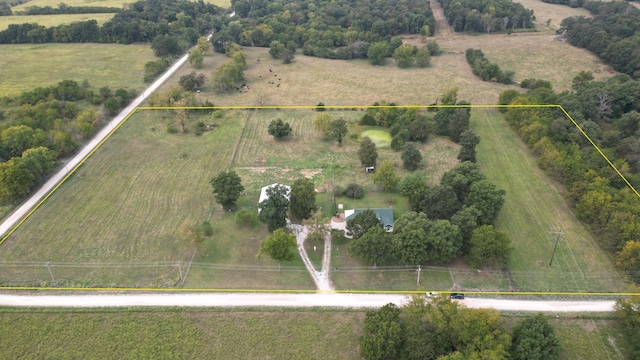 birds eye view of property with a rural view