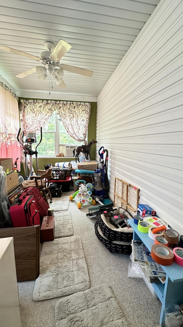 sunroom featuring ceiling fan and cooling unit