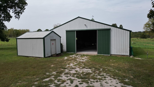 view of outbuilding with a yard