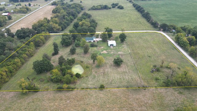 birds eye view of property featuring a rural view