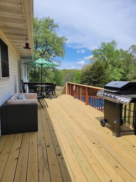 wooden deck featuring grilling area