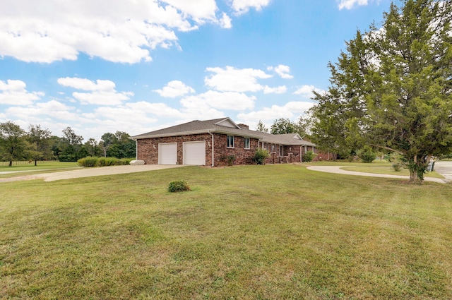 ranch-style house featuring a garage and a front yard