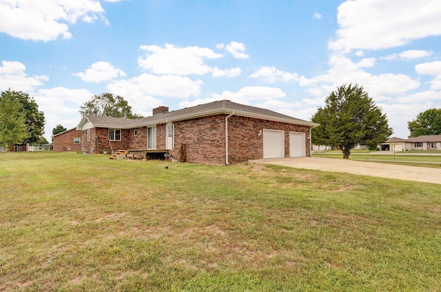 view of home's exterior with a garage and a yard