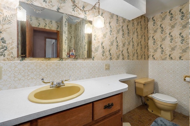 bathroom featuring tile walls, tile patterned floors, vanity, and toilet