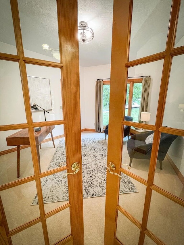 doorway to outside featuring carpet floors