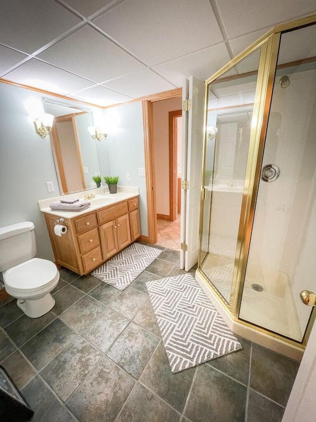 6643 E Turner Springs Dr, Springfield, MO 65809 - bathroom featuring a shower stall, vanity, a drop ceiling, and toilet