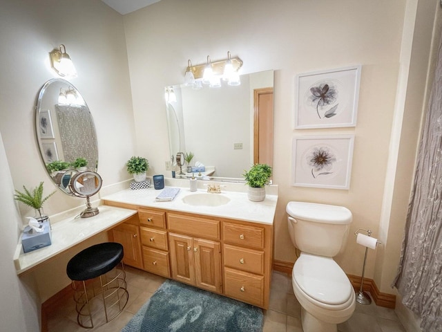 bathroom featuring tile patterned floors, vanity, and toilet