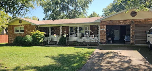 ranch-style house with a garage, covered porch, and a front yard