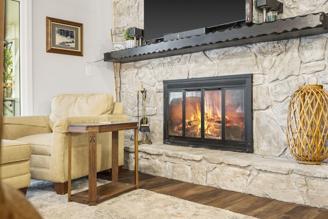 interior details featuring hardwood / wood-style floors and a fireplace