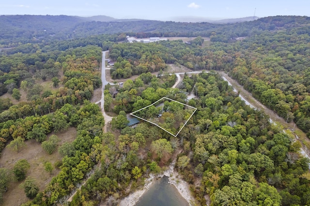 aerial view featuring a mountain view and a view of trees