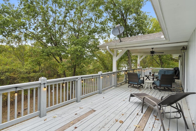 wooden deck featuring a ceiling fan