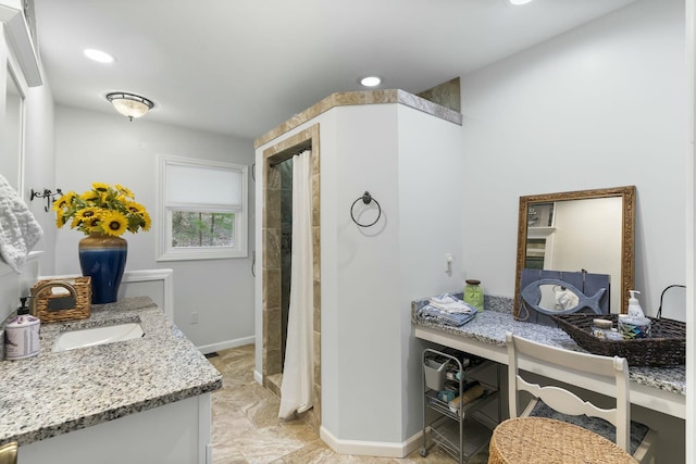 full bath with recessed lighting, baseboards, vanity, and a tile shower