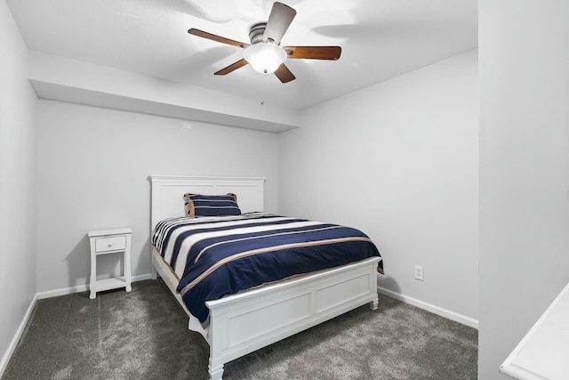 bedroom with ceiling fan and dark colored carpet