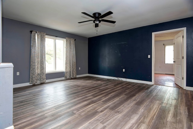 empty room with ceiling fan and wood-type flooring