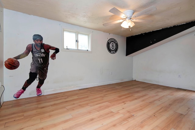 spare room featuring ceiling fan and light hardwood / wood-style floors