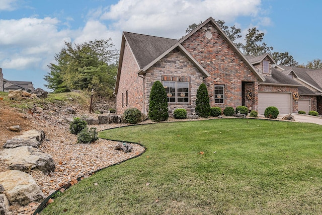 view of front of house with a garage and a front yard