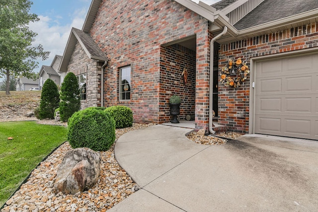 view of exterior entry with a garage