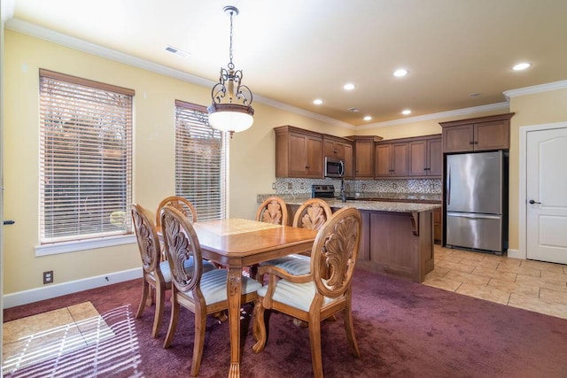 dining area with light colored carpet, ornamental molding, and a healthy amount of sunlight