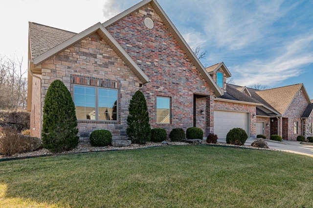 view of front property featuring a garage and a front yard